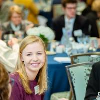 Students at a table with Donna Brooks at Scholarship Dinner 2019
